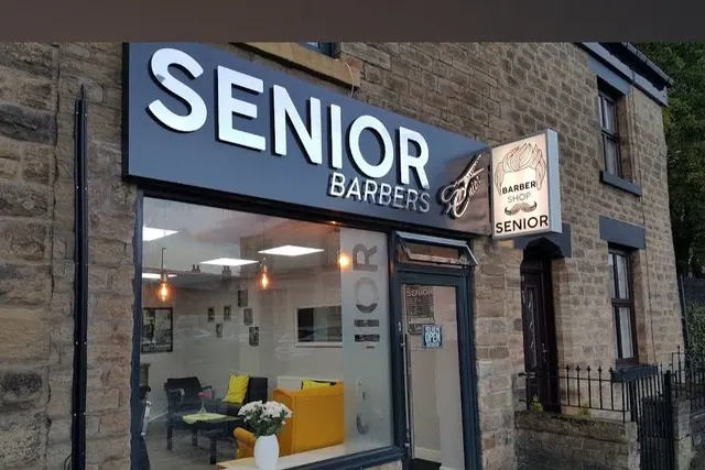 The Senior Barbers front on Belmont Road